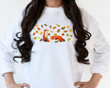 Autumn Foxes with floating leaves on white sweatshirt
